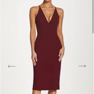 Sleek dress is a slim sheath silhouette with a fitted bodice